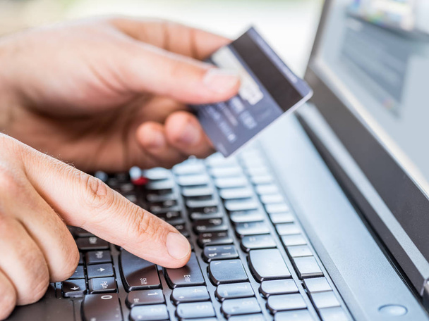 Online shopping using credit card and laptop. - Φωτογραφία, εικόνα