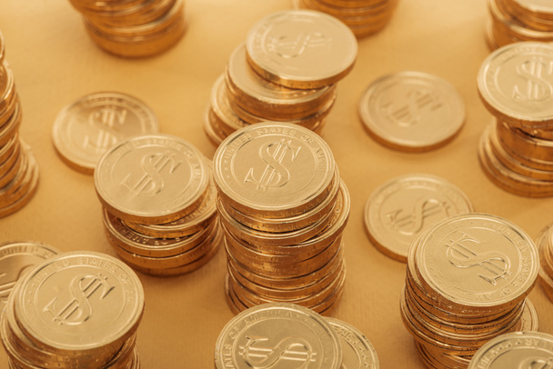 golden coins with dollar signs isolated on orange, st patrick day concept - 写真・画像