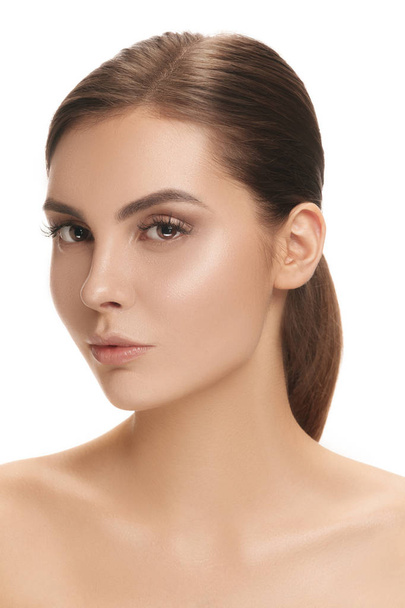 The beautiful female face. The perfect and clean skin of face on white. The beauty, care, skin, treatment, health, spa, cosmetic concept - Valokuva, kuva