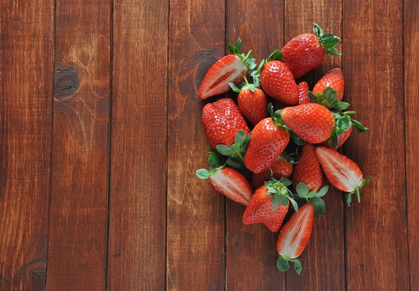 Sweet fresh strawberries on wooden table - Photo, image