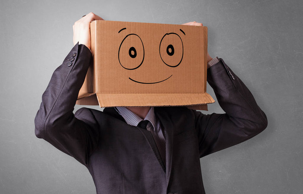 Man with smiling carton box head - Foto, Imagem