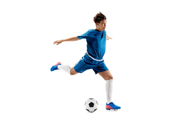 Young boy with soccer ball doing flying kick - Fotoğraf, Görsel