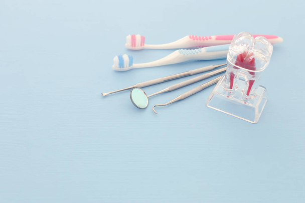 Dental care tools use for dentist in the clinic. Blue background. - 写真・画像
