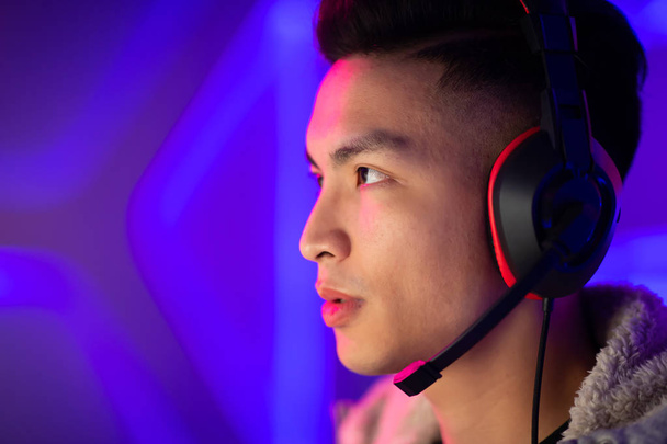 Profile of Young Asian Handsome Pro Gamer Playing in Online Video Game - Fotoğraf, Görsel