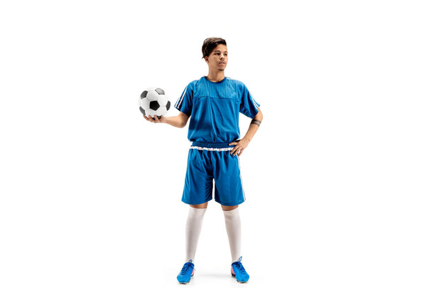 Young fit boy with soccer ball standing isolated on white - Photo, Image