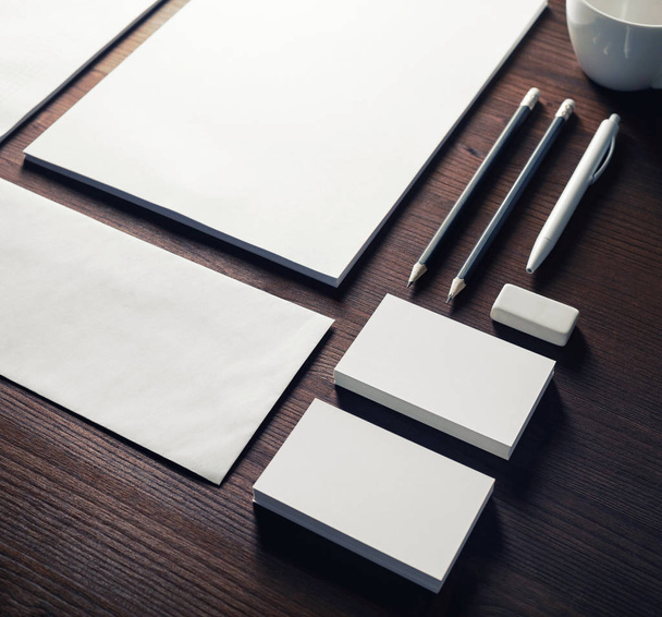 Blank corporate stationery on wooden background. Branding mock-up. - 写真・画像