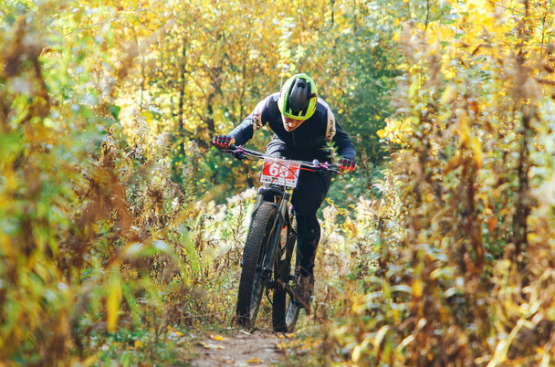 October 14, 2018 - Minsk, Belarus: 2018 Olympic Cross Country Cup XCO in Medvezhino man riding bicycle along forest trail - Photo, Image