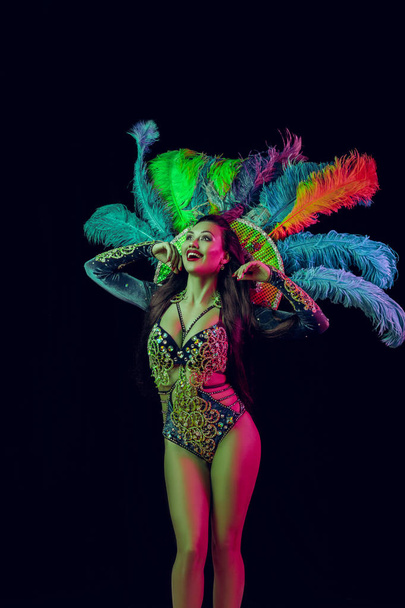 Beautiful young woman in carnival peacock costume - Fotografie, Obrázek