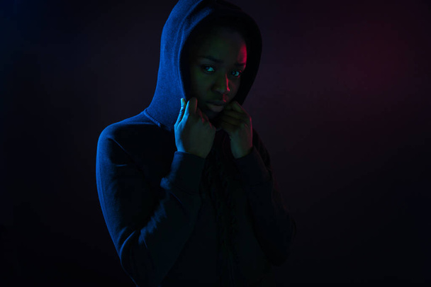 Colorful portrait of a cool black woman with dark skin wearing hoodie - Fotografie, Obrázek