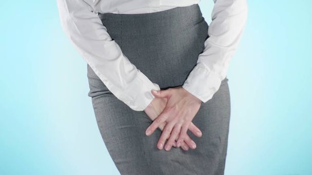 sick business woman with hands holding pressing her crotch lower abdomen. Medical or gynecological problems, healthcare concept. close-up, color background. - Photo, Image