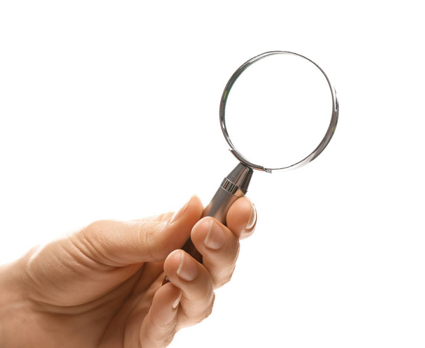 Woman holding magnifying glass on white background, closeup - Foto, Imagen