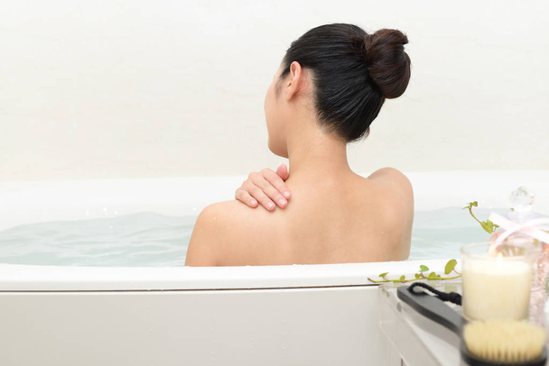 Woman taking a relaxing bath - Zdjęcie, obraz