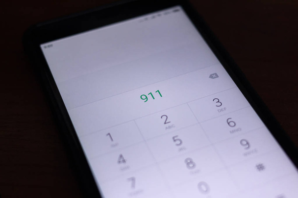 Emergency and urgency, dialing 911 on smartphone screen. - Photo, Image