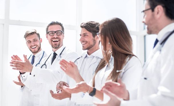 group of successful doctors applauds - Фото, изображение
