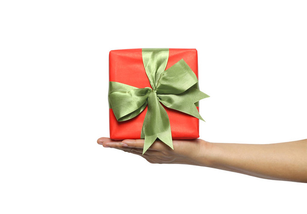 Woman hand holding a red gift box isolated on white background and have clipping paths. - Foto, Bild