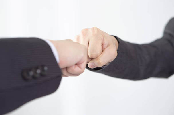 business people touching fists in the office - Fotoğraf, Görsel