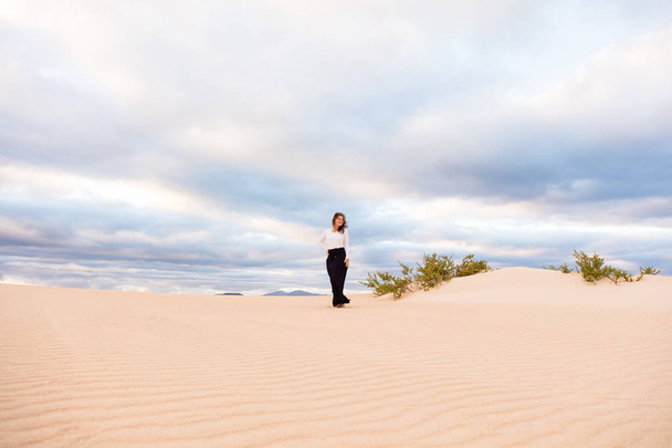 Young woman meditating in desert on Canary Islands, Spain. Relax concept - 写真・画像