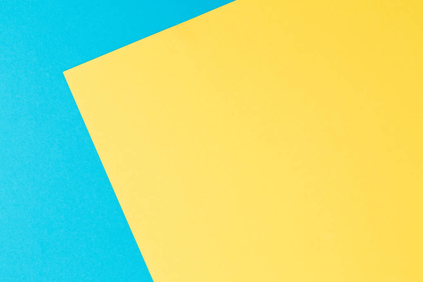 Синий и желтый фактурный фон. Плоский лежал. Вид сверху
 - Фото, изображение