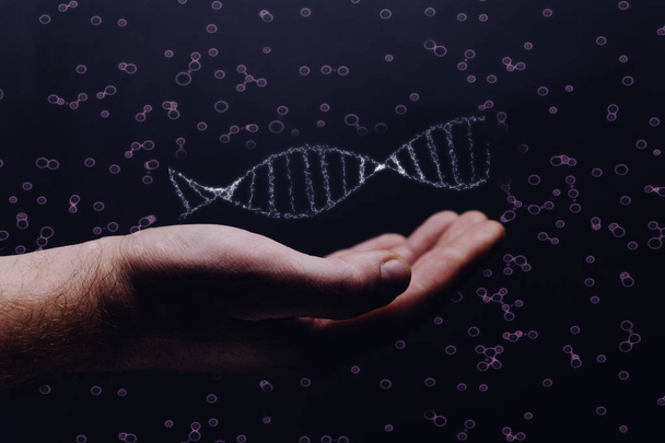 Человек держит молекулу ДНК в ладони
 - Фото, изображение