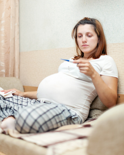 pregnant woman holding thermometer - Photo, Image