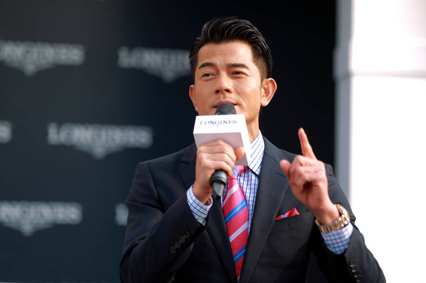 Hong Kong singer and actor Aaron Kwok speaks during the opening ceremony for a watch store of Longines in Tianjin, China, 16 November 2014. - Zdjęcie, obraz