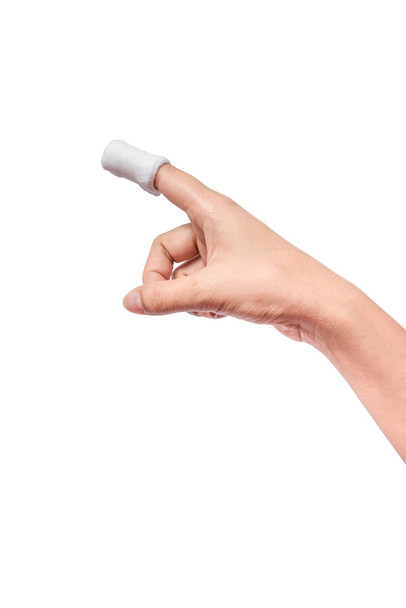 Injured painful finger with white gauze bandage. isolated on white background with clipping path - Photo, Image