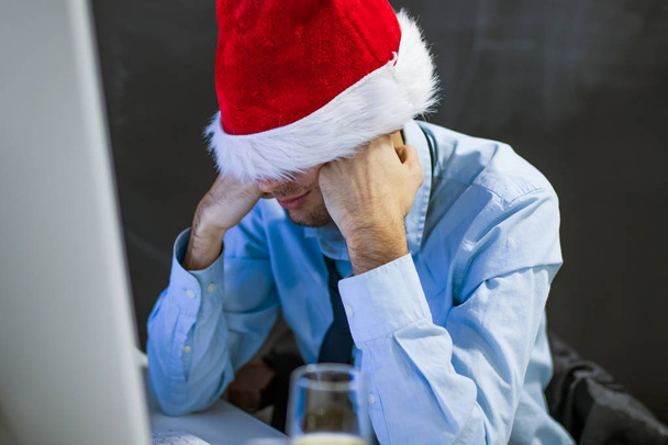 businessman at christmas stressed out at the office - Photo, Image