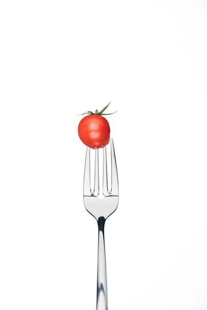 fresh red whole cherry tomato on fork isolated on white - Foto, afbeelding