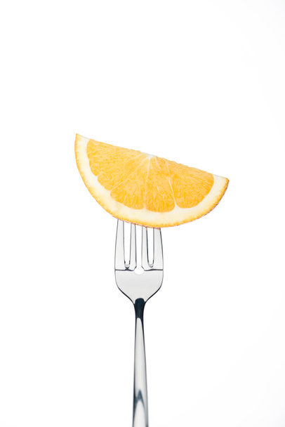 half slice of fresh ripe sweet orange on fork isolated on white - Foto, imagen