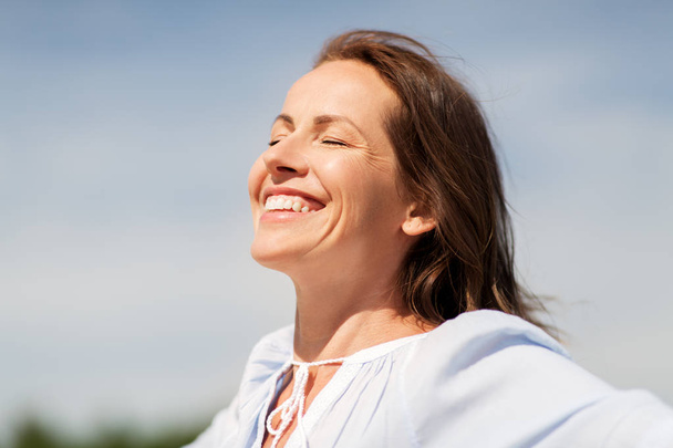 happy smiling woman enjoying sun - Fotó, kép