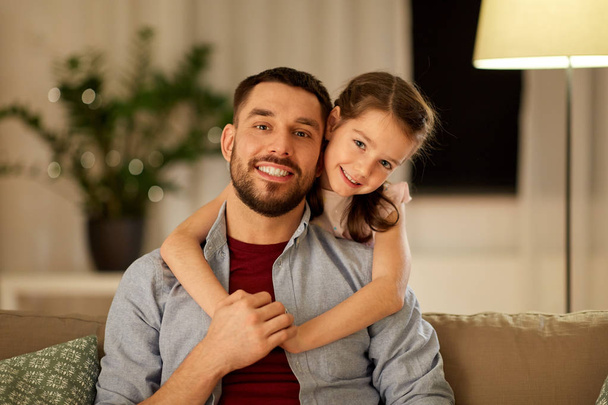 happy father and little daughter hugging at home - Φωτογραφία, εικόνα