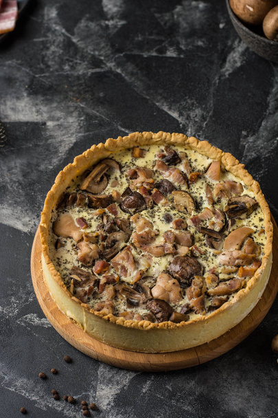 Mushroom Quiche Pie with champignons and cheese on dark background, top view. Savory tart with mushrooms. Galette. Tart with chicken. Chicken pie. Mushroom pie - Zdjęcie, obraz