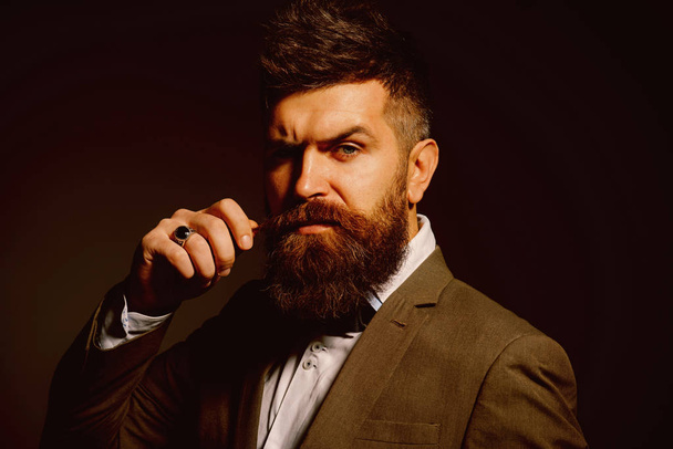 People in fashion treat it as a business. Bearded man after barber shop. Man with long beard in business wear. Business as usual. Mens fashion. Barber in shop - Photo, image