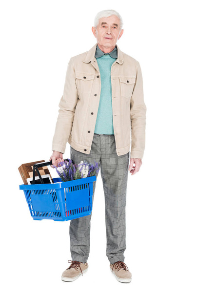 retired man holding shopping basket isolated on white - Foto, imagen