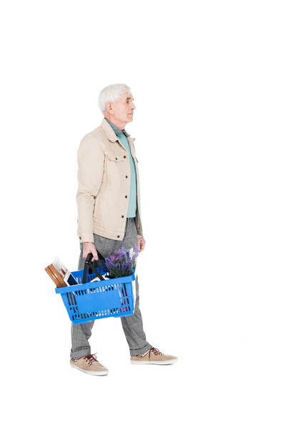 retired man walking with shopping basket isolated on white - 写真・画像