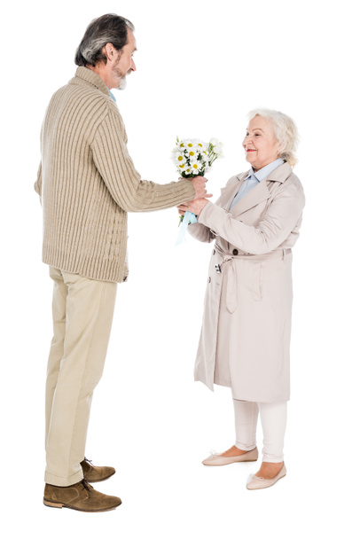 senior man giving flowers to happy woman isolated on white - Φωτογραφία, εικόνα