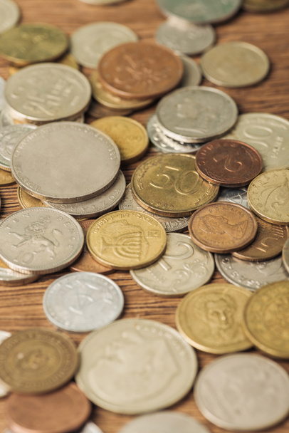 selective focus of different silver and golden coins on wooden background - 写真・画像
