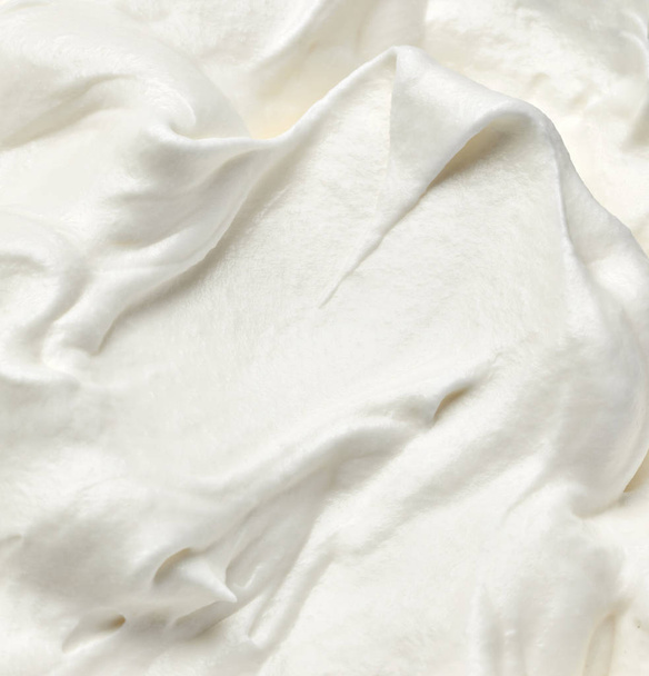 close up of  a white whipped or sour cream on white background - Photo, Image