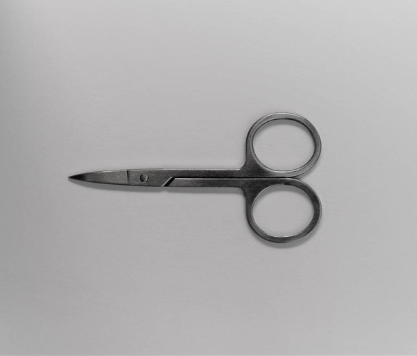 small scissors on white background - Zdjęcie, obraz