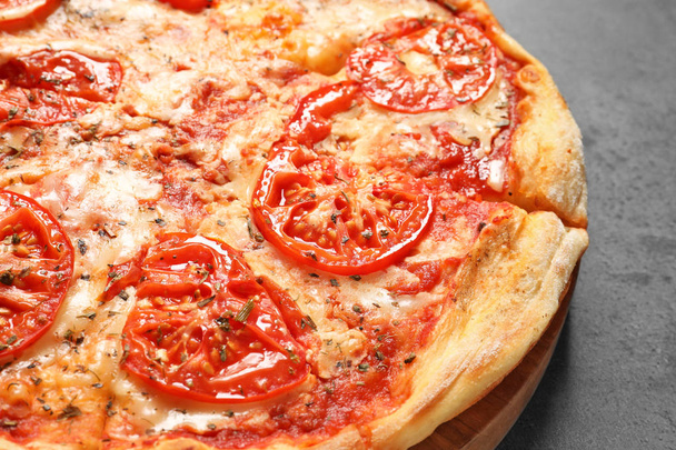 Hot cheese pizza Margherita on grey background, closeup - Foto, imagen