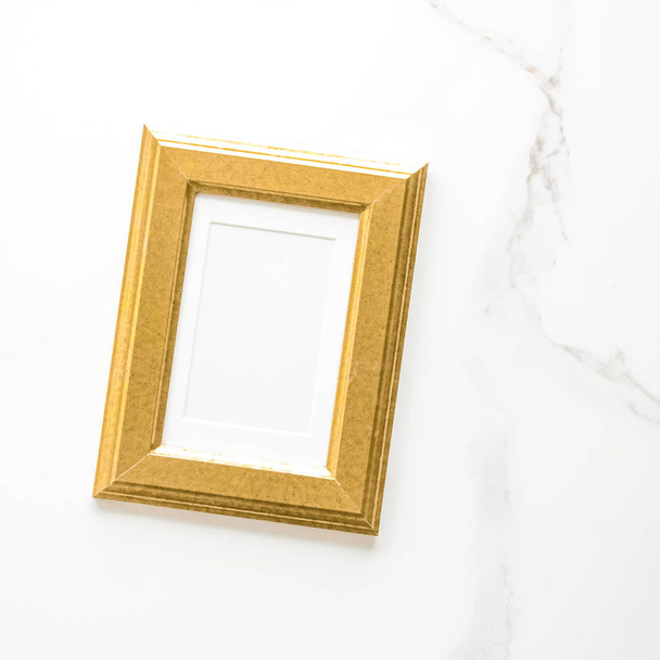 Golden photo frame on marble, flatlay - modern feminine, artwork mock up, luxury design concept. Decorate with chic and style - Photo, Image