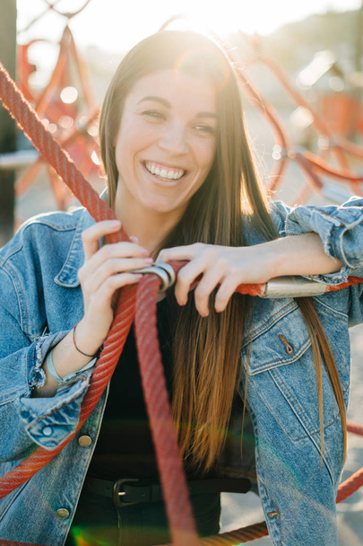 Young beautiful woman smiling outdoors in a par - Fotó, kép