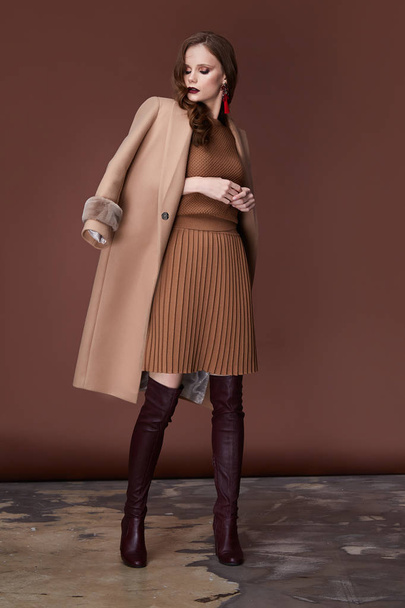 Sexy beauty woman pretty face wear brown knitted suit dress long skinny body shape makeup cosmetic winter collection studio catalog brunette accessory clothes for office casual dress code fashion. - Valokuva, kuva