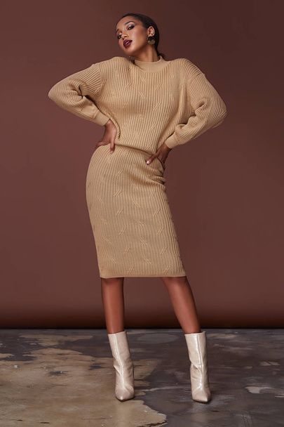 Sexy beauty woman pretty face tan skin wear beige knitted suit dress long skinny body shape makeup cosmetic summer collection studio catalog brunette accessory clothes for office party fashion shoes. - Photo, Image