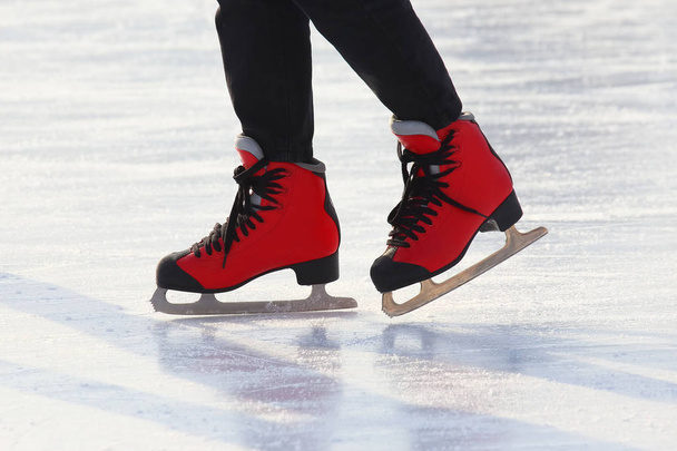 Feet skating on the ice rin - Photo, Image