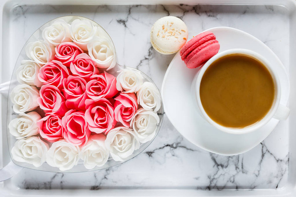 cup of coffee, macarons and roses on granite background  - Fotografie, Obrázek