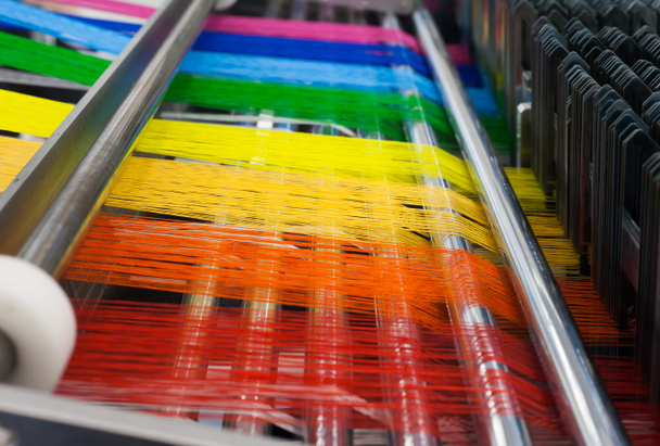Textile machine with rainbow colors threads - Photo, Image