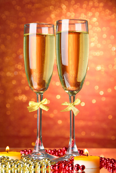 Two glasses of champagne on bright background with lights - Fotoğraf, Görsel