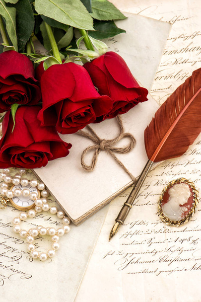 Old letters, red rose flowers and antique feather pen. Valentined Day Love concept - Фото, зображення