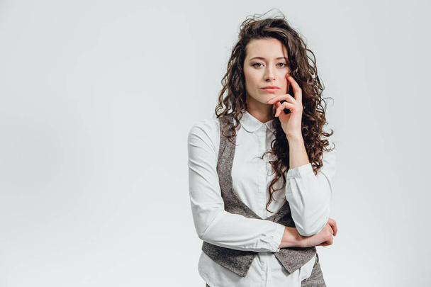 Portrait of an attractive business woman with her hand crossed a white background. - Fotó, kép